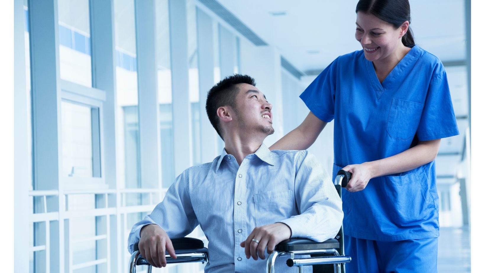 A nurse transporting a patient.